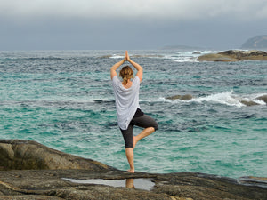 Balancing Yoga Pose Tree in front of Water