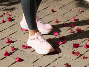 Pink Adaptive Sneakers on Pavers