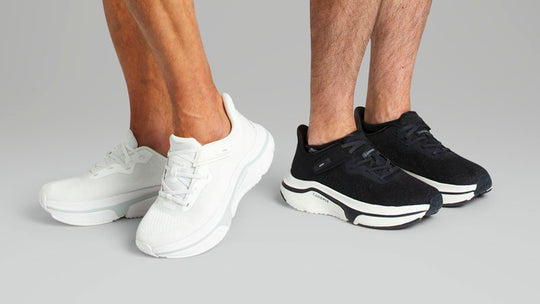 Two men wearing black and white adaptive sneaker