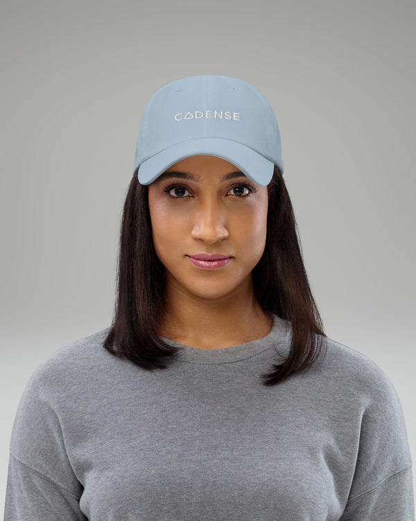 Female wearing light blue baseball hat