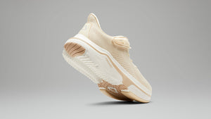 Bottom and side view of champagne color Cadense shoe