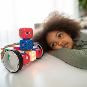 Child playing with Toy Robot