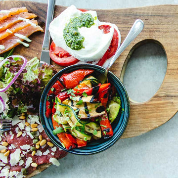 Delicious looking salad and veggies on board