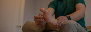 man stretching his toes