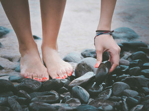 Woman Picking up rocks