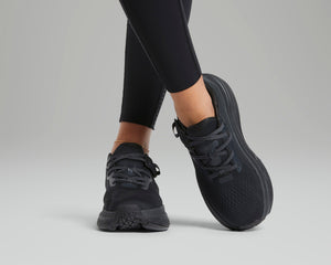 Woman wearing all black adaptive shoes