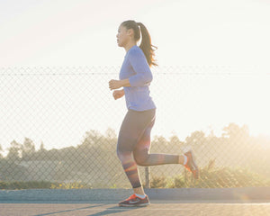 Young woman running outside