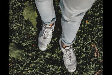 feet walking on grass