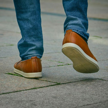 Best Shoes for Walking After a Stroke - shoes walking down sidewalk - Cadense