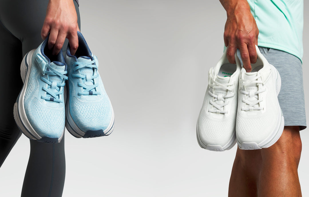 People holding sneakers on a neutral background