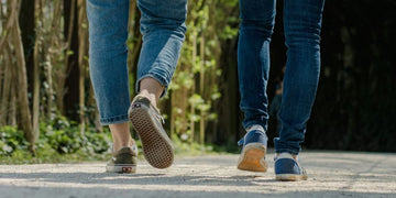 Best Shoes for Walking After a Stroke - two people walking with shoes on concrete - Cadense