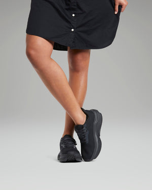 Woman wearing all black adaptive shoes