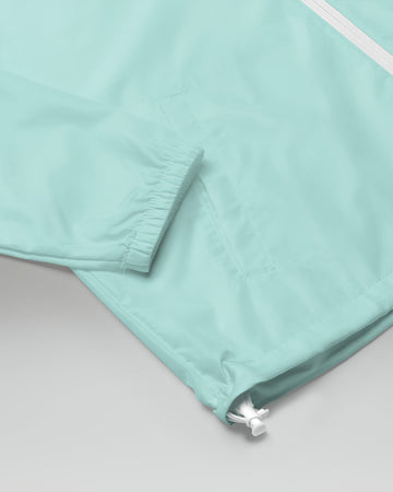 [color: aqua] Sleeve close up of Cadense Airwave Windbreaker.