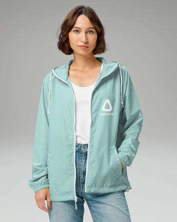 [color: aqua] Young female adult wearing the aqua-colored Cadense Airwave Windbreaker.