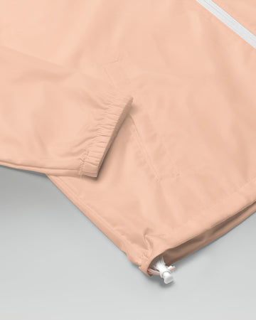 [color: blush] Sleeve of blush-colored Cadense Airwave Windbreaker.