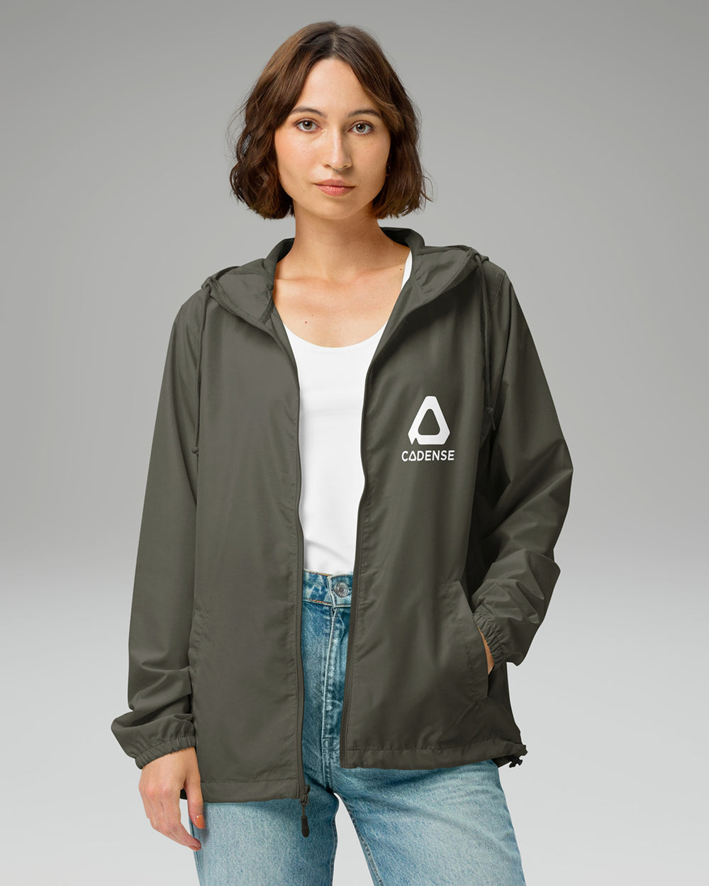 [color: graphite] Female model wearing graphite-colored Cadense Airwave Windbreaker.