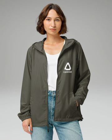 [color: graphite] Female model wearing graphite-colored Cadense Airwave Windbreaker.