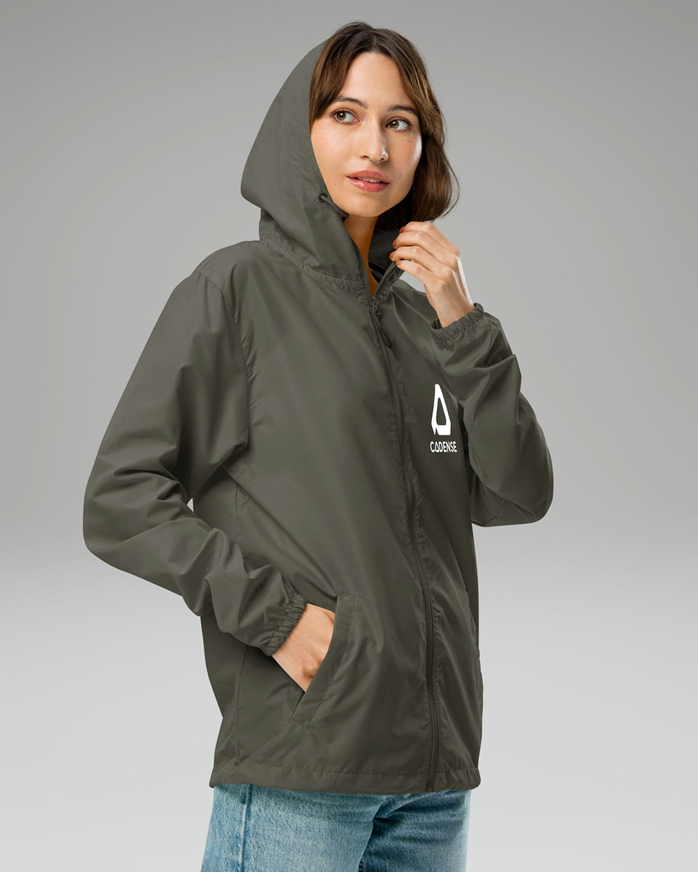 [color: graphite] Female model wearing graphite-colored Cadense Airwave Windbreaker.