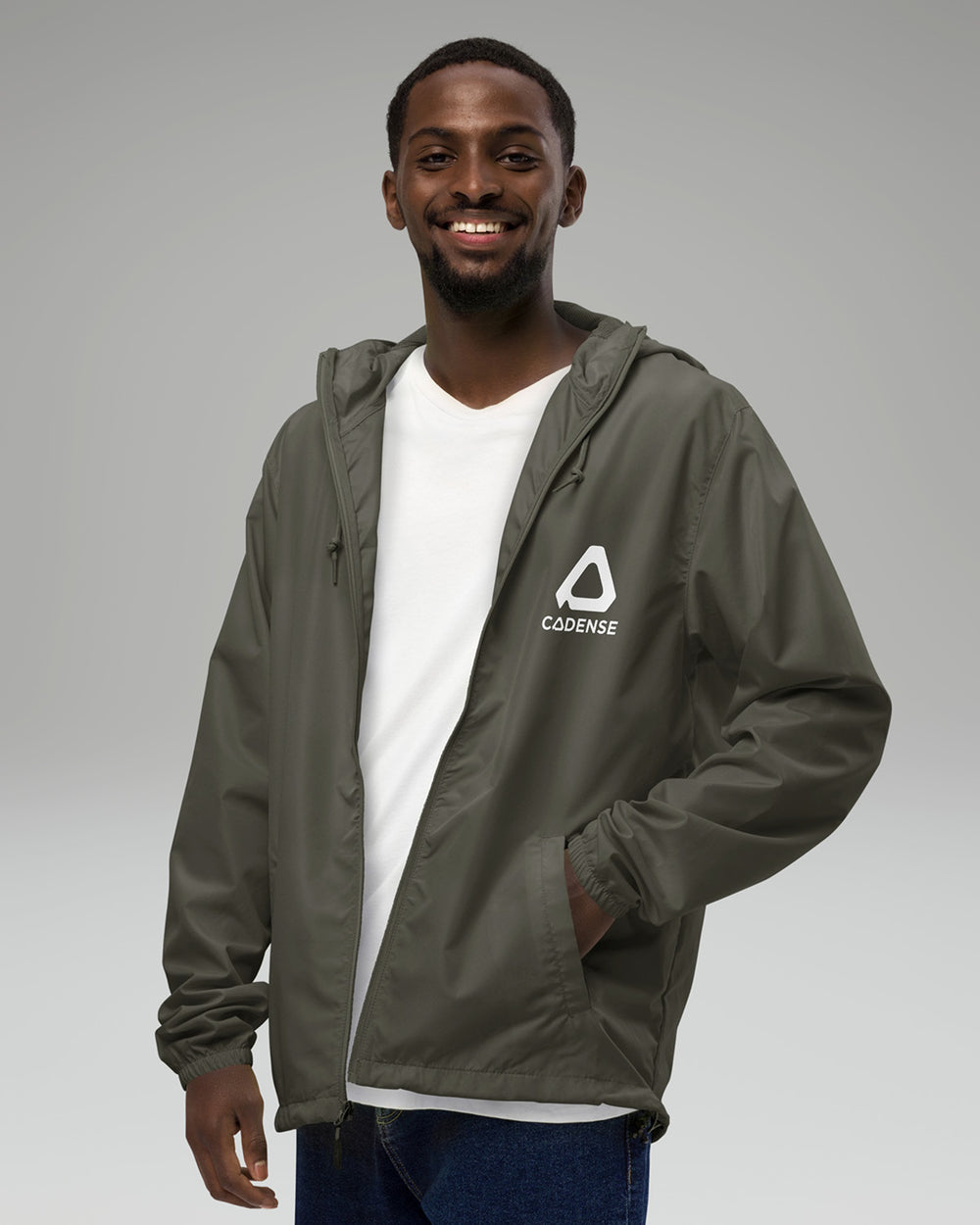 [color: graphite] Young male adult wearing the graphite-colored Cadense Airwave Windbreaker.
