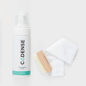 Foam cleaning solution, brush, and washcloth included in the Cadense Cleaning Kit 