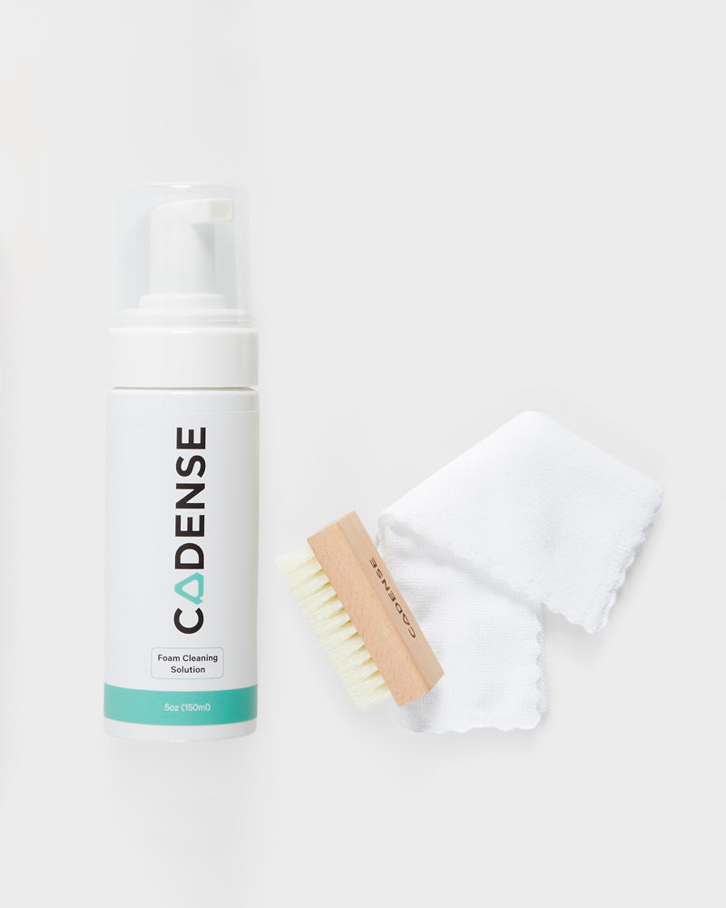 Foam cleaning solution, brush, and washcloth included in the Cadense Cleaning Kit 