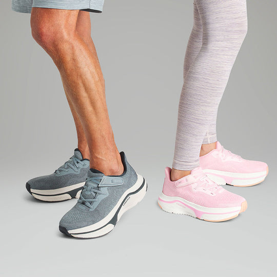 Man and woman posing with adaptive sneakers