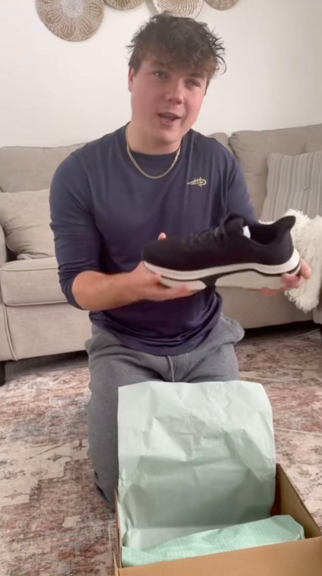 Mason unboxing a Cadense Adaptive Sneaker
