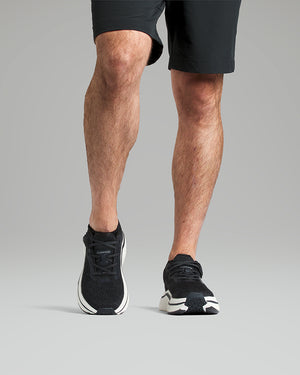 Man wearing black sneakers