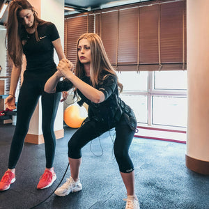 Physical Therapy session administered by a young female trainer