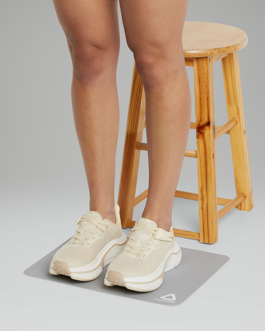 woman standing on the transition mat 
