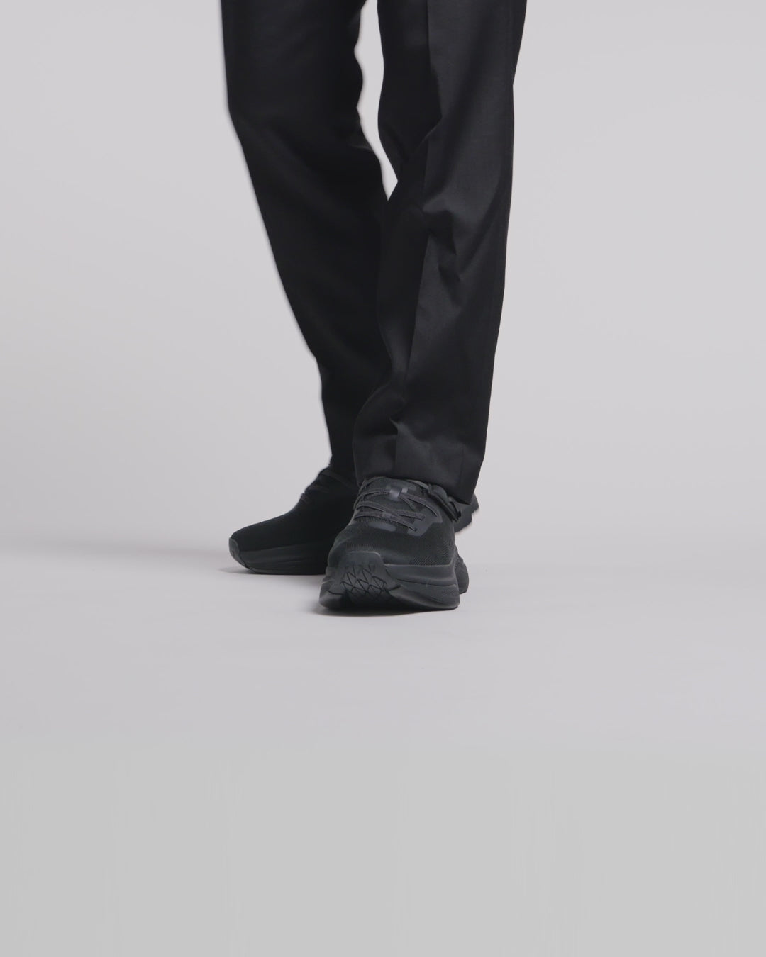 Man wearing all black adaptive shoes